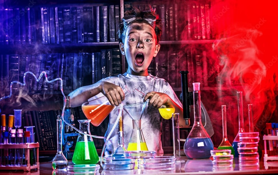 index-cover image of a young boy doing lab experiments