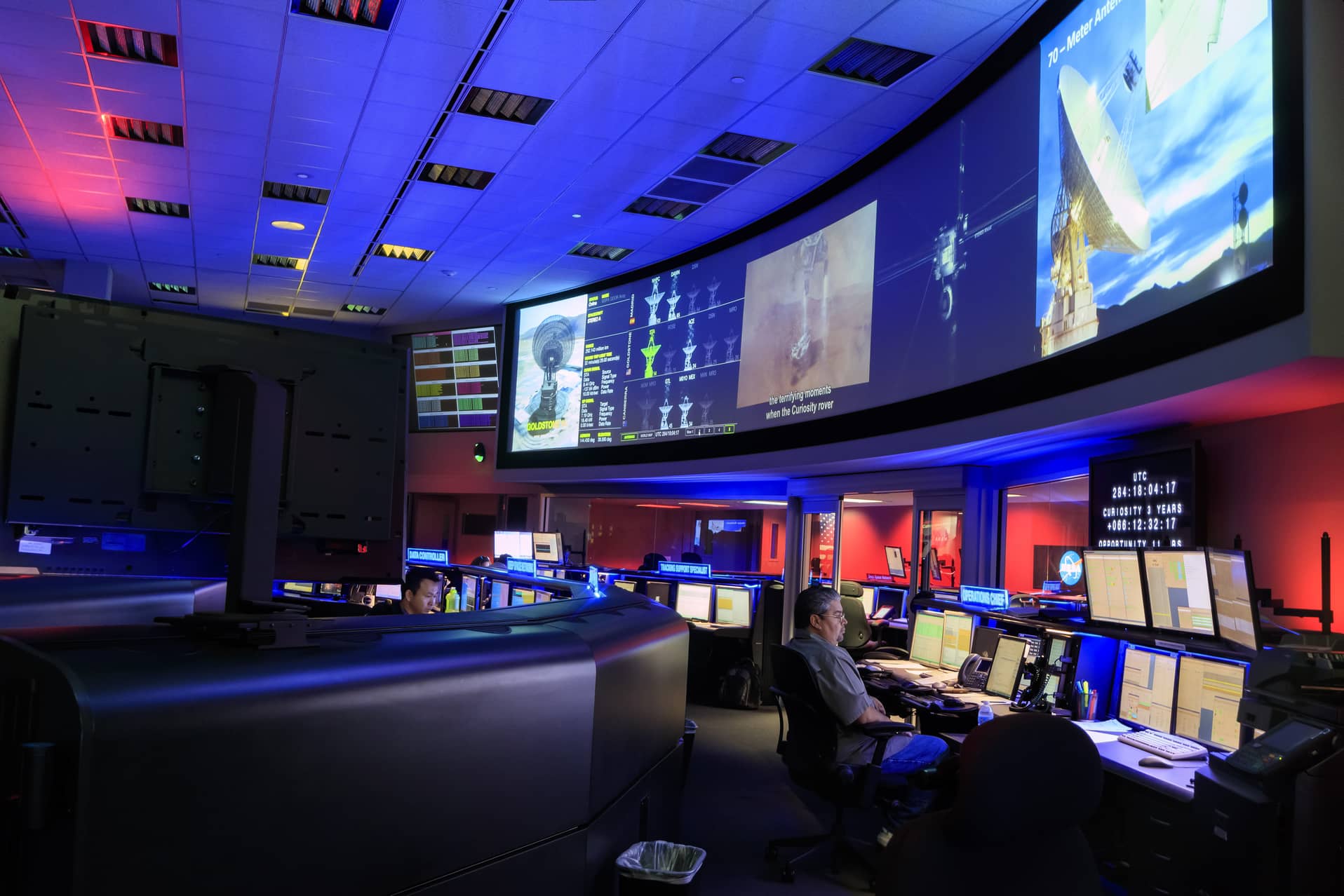 a control room on nasa with all with all experts professors